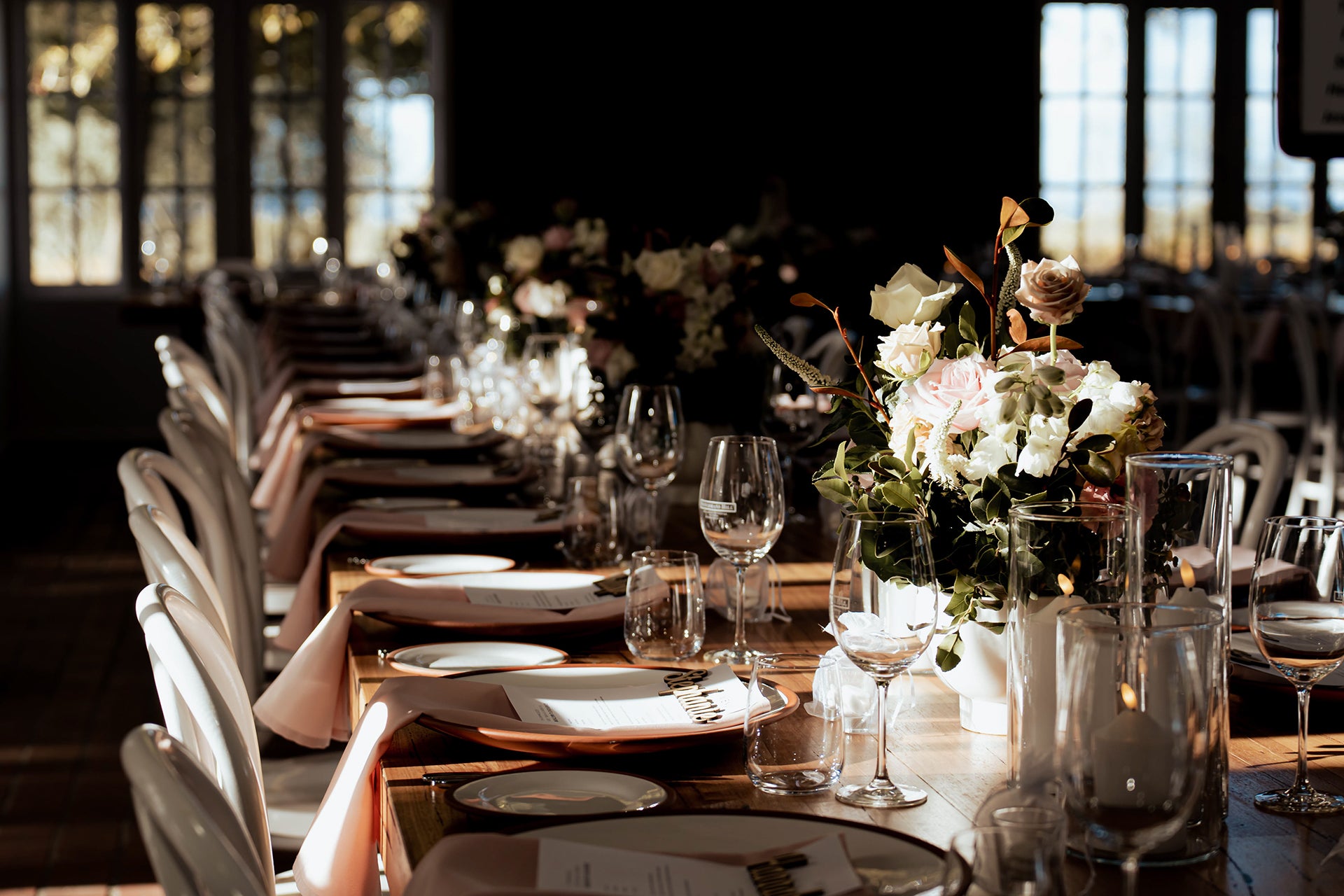 Elegant wedding tablescape with pink roses and glassware at The Residence, Scotchmans Hill, perfect for Bellarine Peninsula weddings.