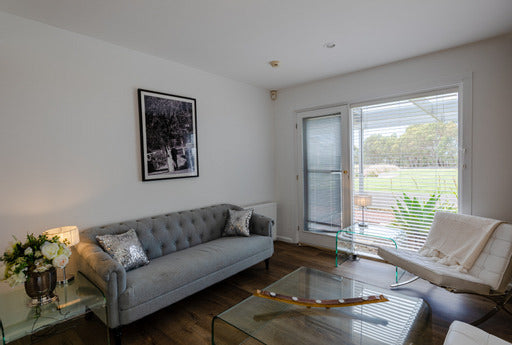 Bright, elegant Bridal Retreat suite at Scotchmans Hill with plush seating and vineyard views, perfect for wedding preparations.