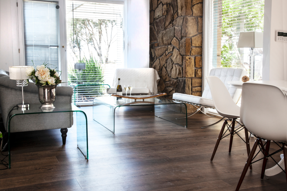 Elegant bridal retreat suite at Scotchmans Hill winery with natural light, stone walls, and champagne on arrival.