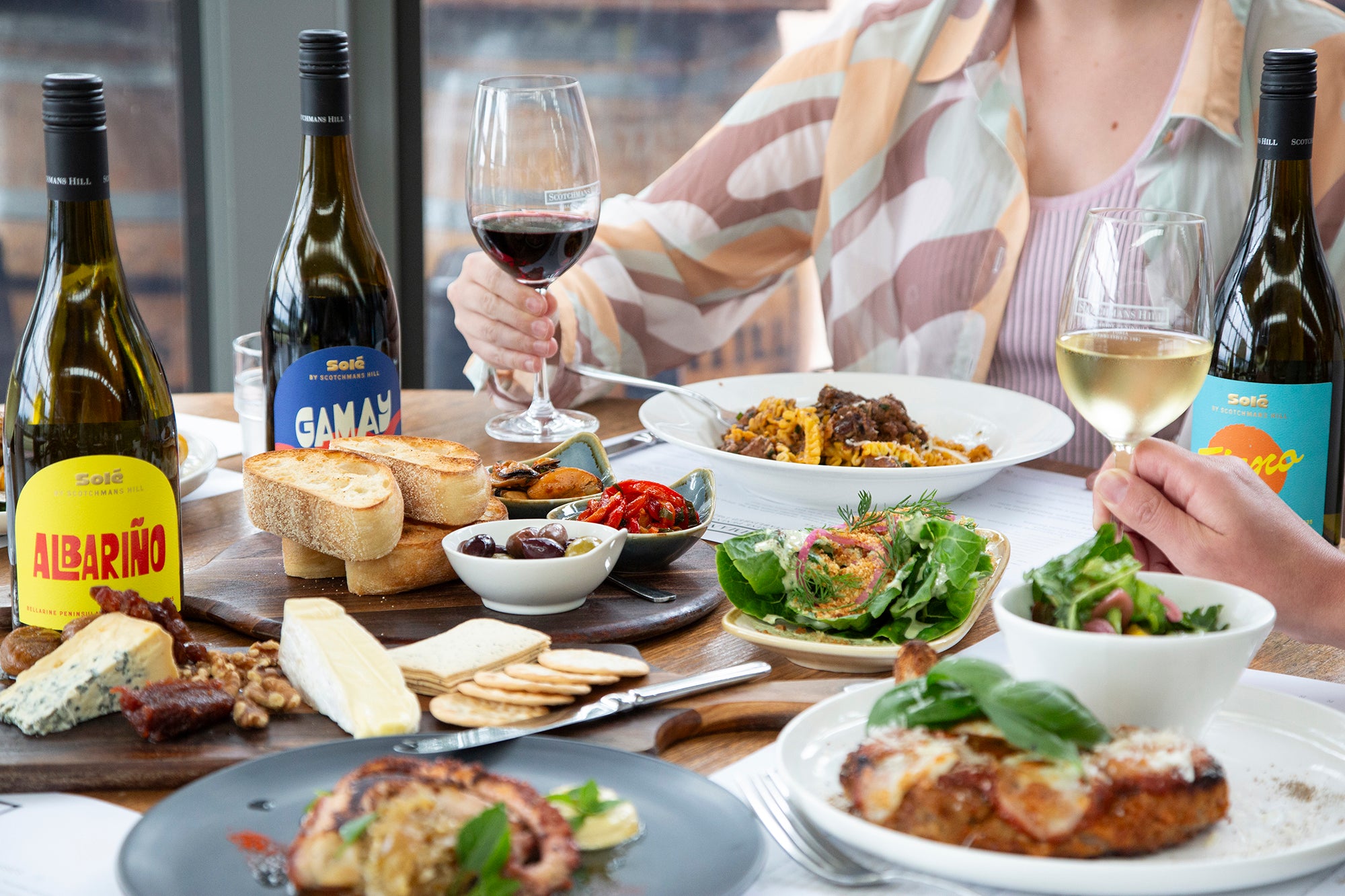 Dining at Scotchmans Hill restaurant with shared dishes and Bellarine Peninsula wines